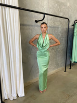 Alice Dress by Lexi, in kiwi green colour, deep cowl neckline, luxe satin fabric, halter tie-up back with adjustable strap, sleek straight fit with back split. Hire for weddings, special events, formal events, school balls.