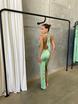 Alice Dress by Lexi, in kiwi green colour, deep cowl neckline, luxe satin fabric, halter tie-up back with adjustable strap, sleek straight fit with back split. Hire for weddings, special events, formal events, school balls.